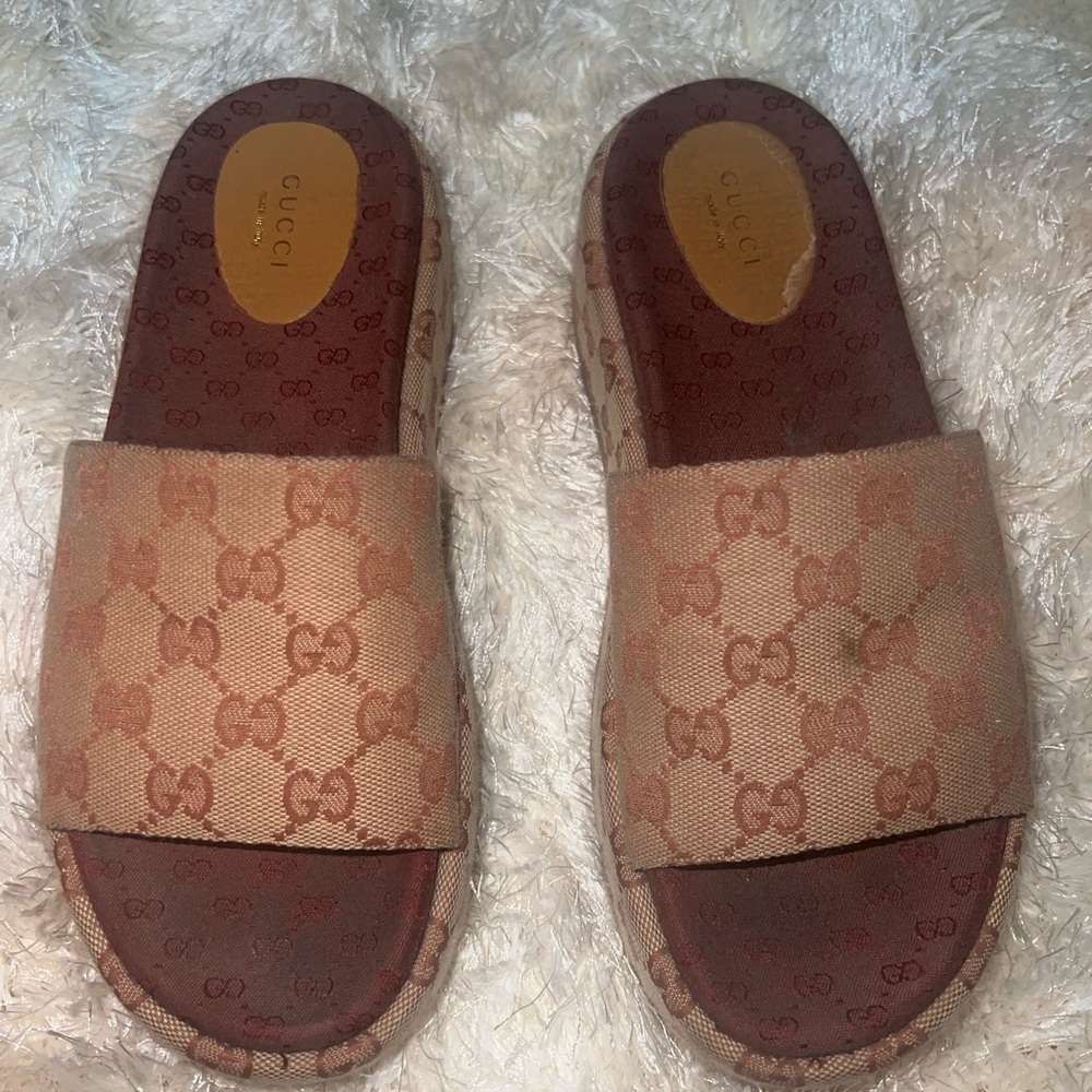 Brown Gucci slides size 39 with medium wear.